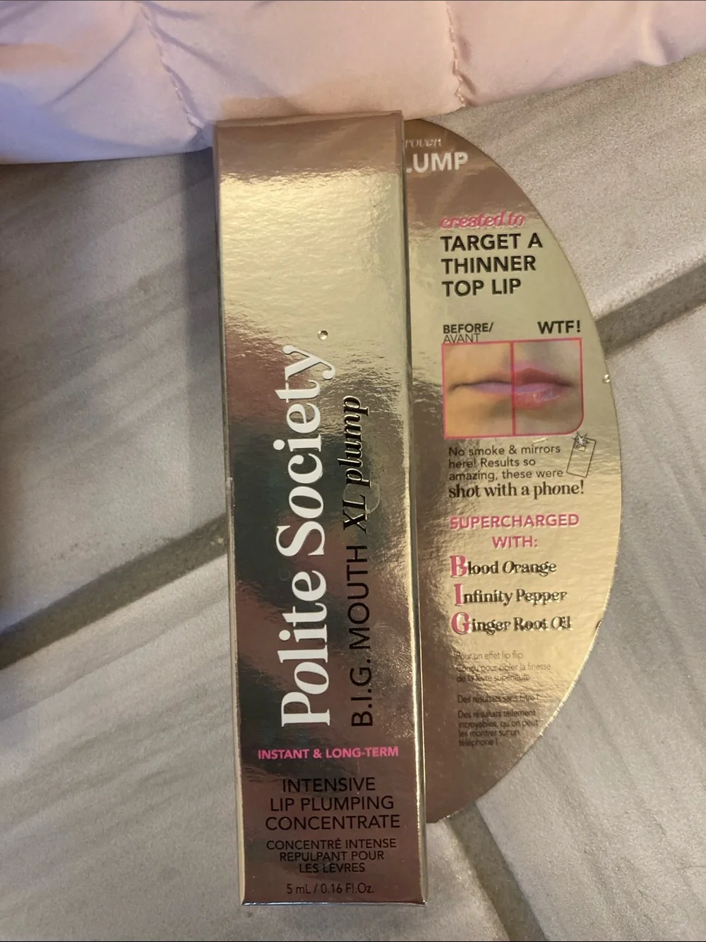 Polite Society lip plump, setting powder, and bag